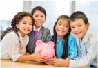 Young children holding a piggy bank